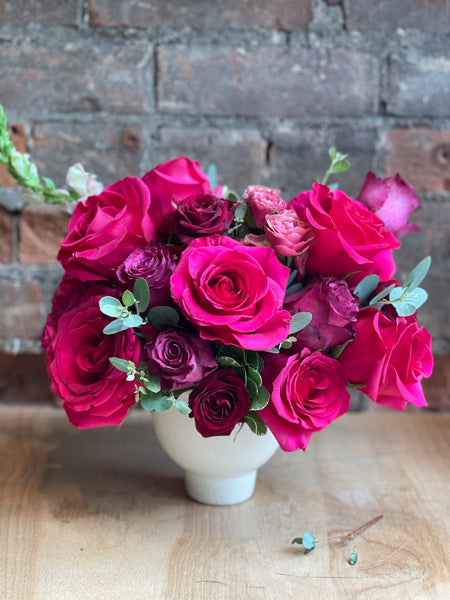 Bright pink and red rose arrangement