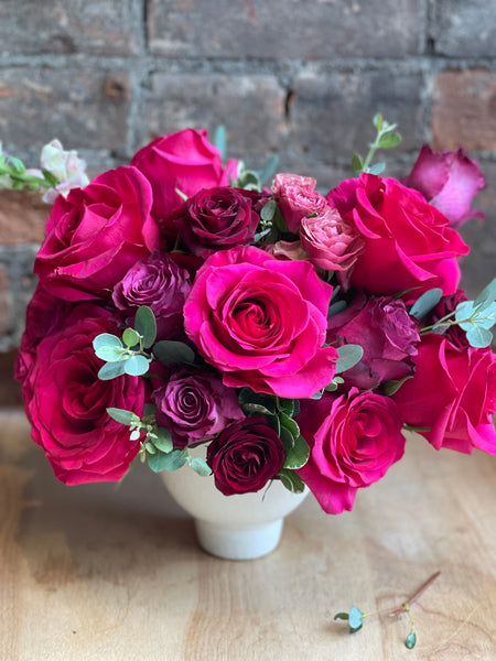 Bright pink and red rose arrangement
