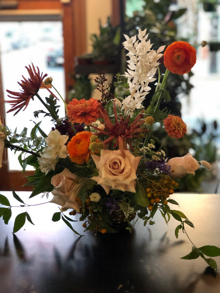 Large compote arrangement in fall tones